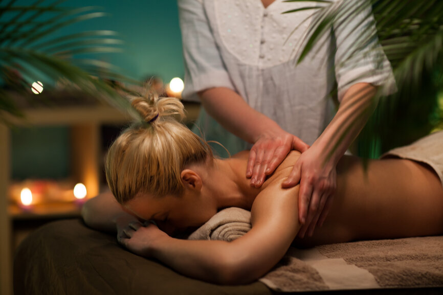 Woman enjoying a relaxing back massage.